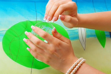 beautiful female hands with ideal sculptured french manicureの写真素材