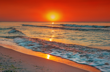 Fantastic sunset over the ocean on island of Sri Lanka.の写真素材