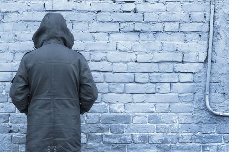 man against wallの写真素材