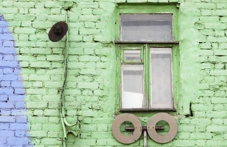old window and green wall -focus on the windowの写真素材