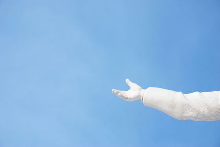 hand and sky (space for your text,focus point on the hand)の写真素材