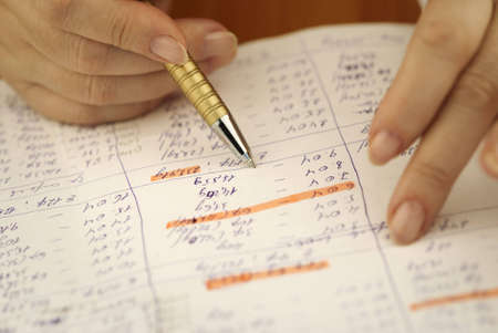 paper work (special toned photo f/x, focus point on the pen)の写真素材