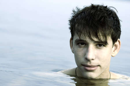 cute young adult in the water (focus point on eye, special toned)