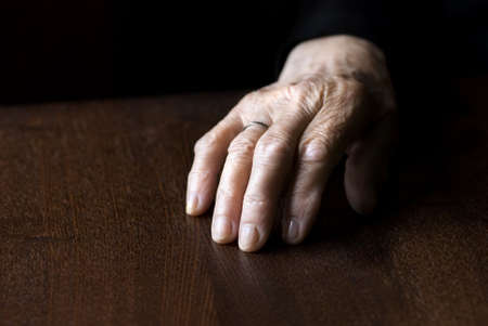 wrinkled hand of old woman (focus point on fingers)の写真素材