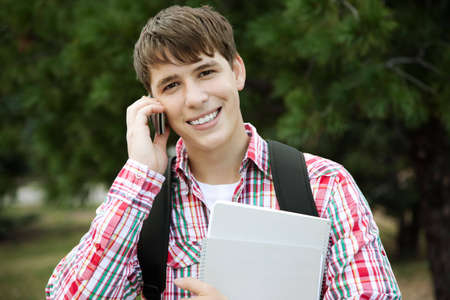 happy student on the phoneの写真素材