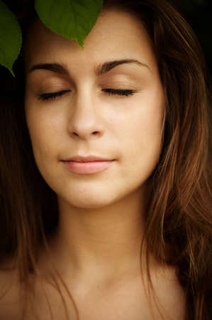 spring or summer concept, selective focus on eye of womanの写真素材