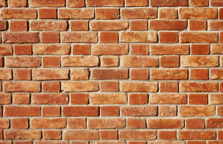 texture with old bricks and natural golden sunlight, focus point on centerの写真素材