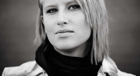 close-up of blond young woman ,urban portrait, natural lightの写真素材