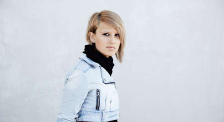blond young woman ,urban portrait, natural lightの写真素材