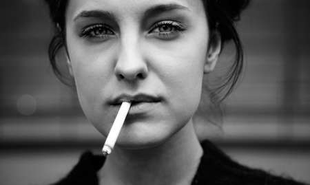 real young woman smokes の写真素材