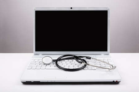 Stethoscope and white laptopの写真素材