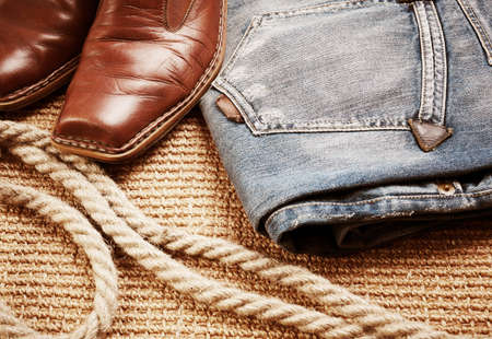 leather boots and jeans, special toned , selective focus on nearest partsの写真素材