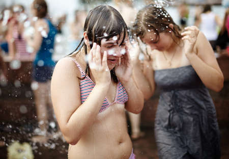  wet girls covered from water streams. Photo taken in Samara city,Russia during a Water Wars flashmobのeditorial素材