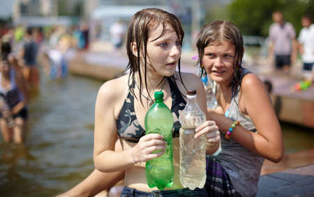  wet girl with plastic bottles. Photo taken in Samara city,Russia during a Water Wars flashmobのeditorial素材