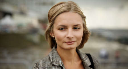 portrait of blond young woman outsideの写真素材