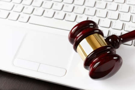 gavel on white laptopの写真素材