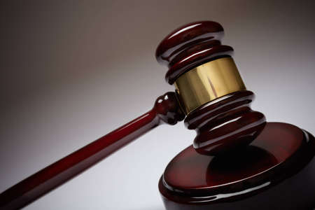 Wooden gavel, selective focus on metal partの写真素材