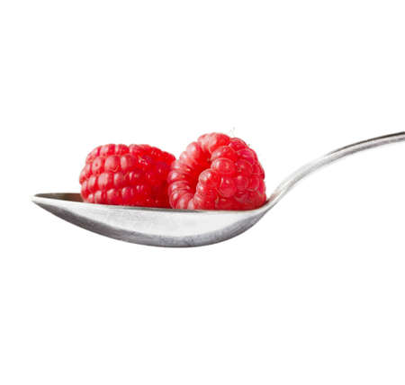 fresh raspberries with dessert spoon の写真素材