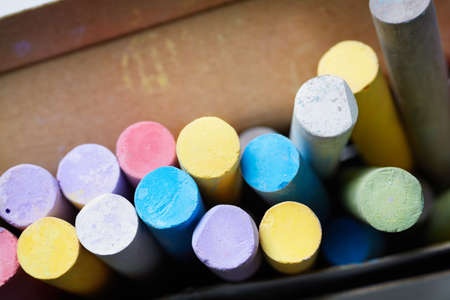 Mix of colorful chalk in paper box, selective focusの写真素材