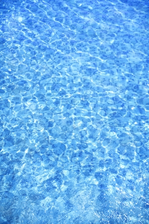 pure and clear blue water in a swimming pool, summer backgroundの写真素材