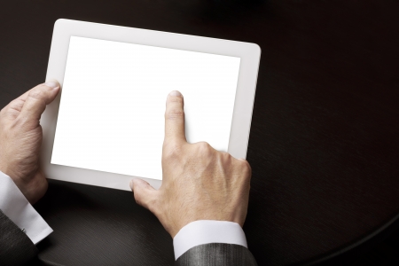 adult using digital tablet with empty white screenの写真素材