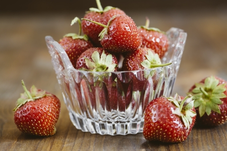 Beautiful red strawberries in a small glass tasterの写真素材