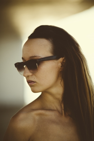 young woman with vintage sunglasses ,natural lightの写真素材