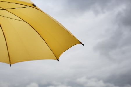 safety concept with part of ubrella and clouds