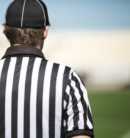 back of a football referee in closeup , selective focusの写真素材