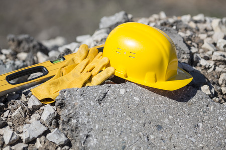 yellow hardhat and gloves, natural lightの写真素材