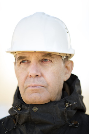 Real experienced builder with white hardhatの写真素材