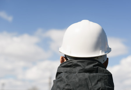 man with white hardhat from behindeの写真素材