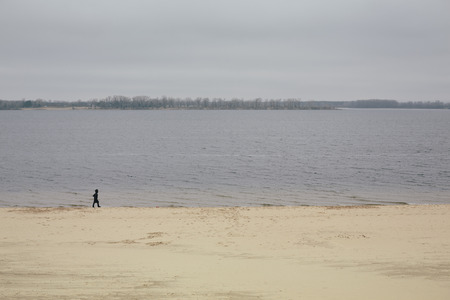 woman walking near the cold river