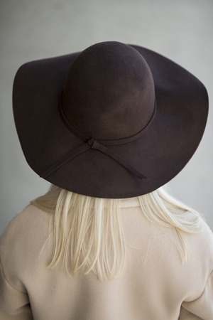 trendy blond woman wearing hatの写真素材