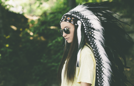 woman in a headdress on the nature backgroundの写真素材