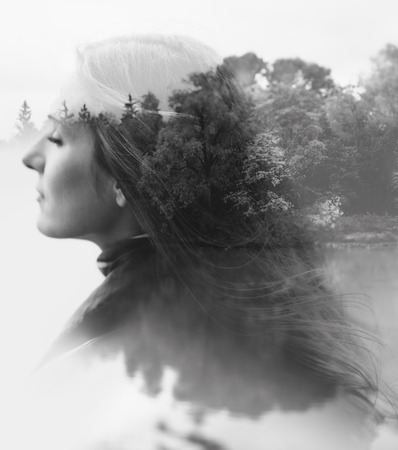 double exposure of young female and the forest near the lake(tilt-shift lens)の写真素材
