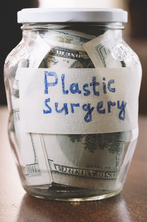 jar with money for plastic surgeryの写真素材