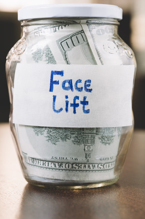 jar with money for face liftの写真素材