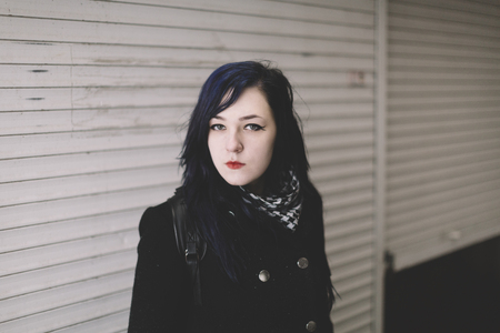 winter portrait of young woman on the street( great DOF)の写真素材