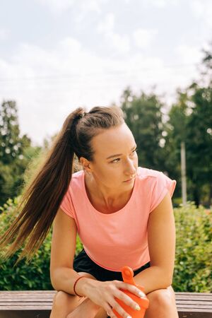 sportive woman in sportswear working out on streetの写真素材