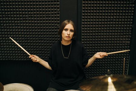 Young woman playing drums, selective focusの写真素材