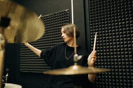 Young woman playing drums, selective focusの写真素材
