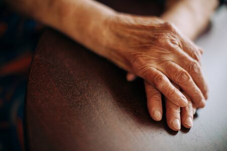real senior woman at home , natural light , selective focus pointの写真素材