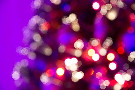beautiful blurry christmas background with colored lights