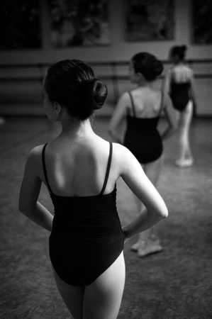 Ballerina are dancing in the dance hall. Close-up of a ballerina in the dance hall. Black and white photography.の写真素材