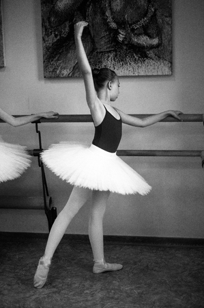 Ballerina are dancing in the dance hall. Close-up of a ballerina in the dance hall. Black and white photography.の写真素材
