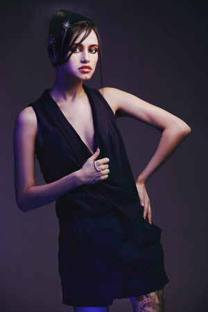 Girl model fashion dress on a dark background.の写真素材