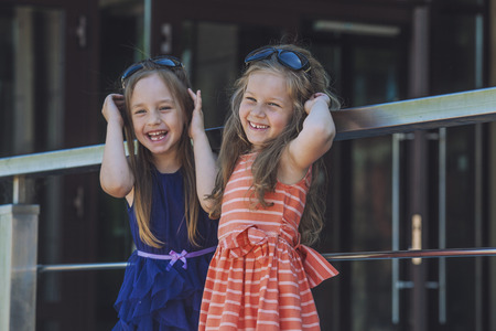 Kids girls ladies amid the shopping centre in the cityの写真素材