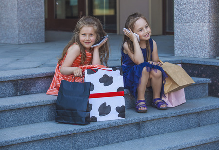 Kids girls ladies amid the shopping centre in the cityの写真素材