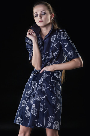 Model beautiful women in fashionable clothes and accessories shot isolated on a black background in the Studioの写真素材